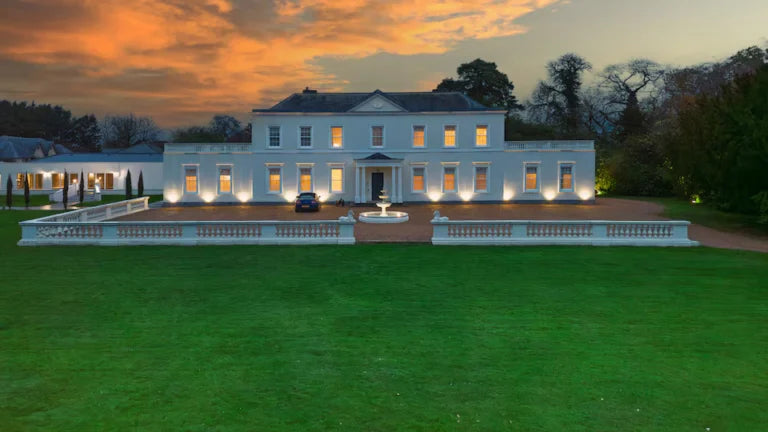 The Georgian manor at dusk